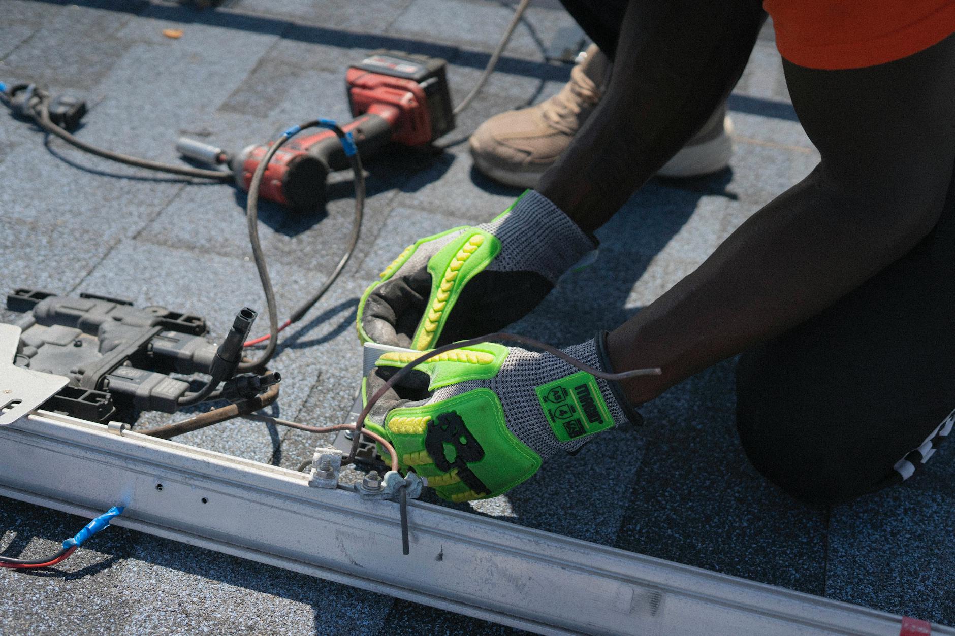 A professional roofing crew installing energy-efficient shingles on a home in Paradise, Nevada.