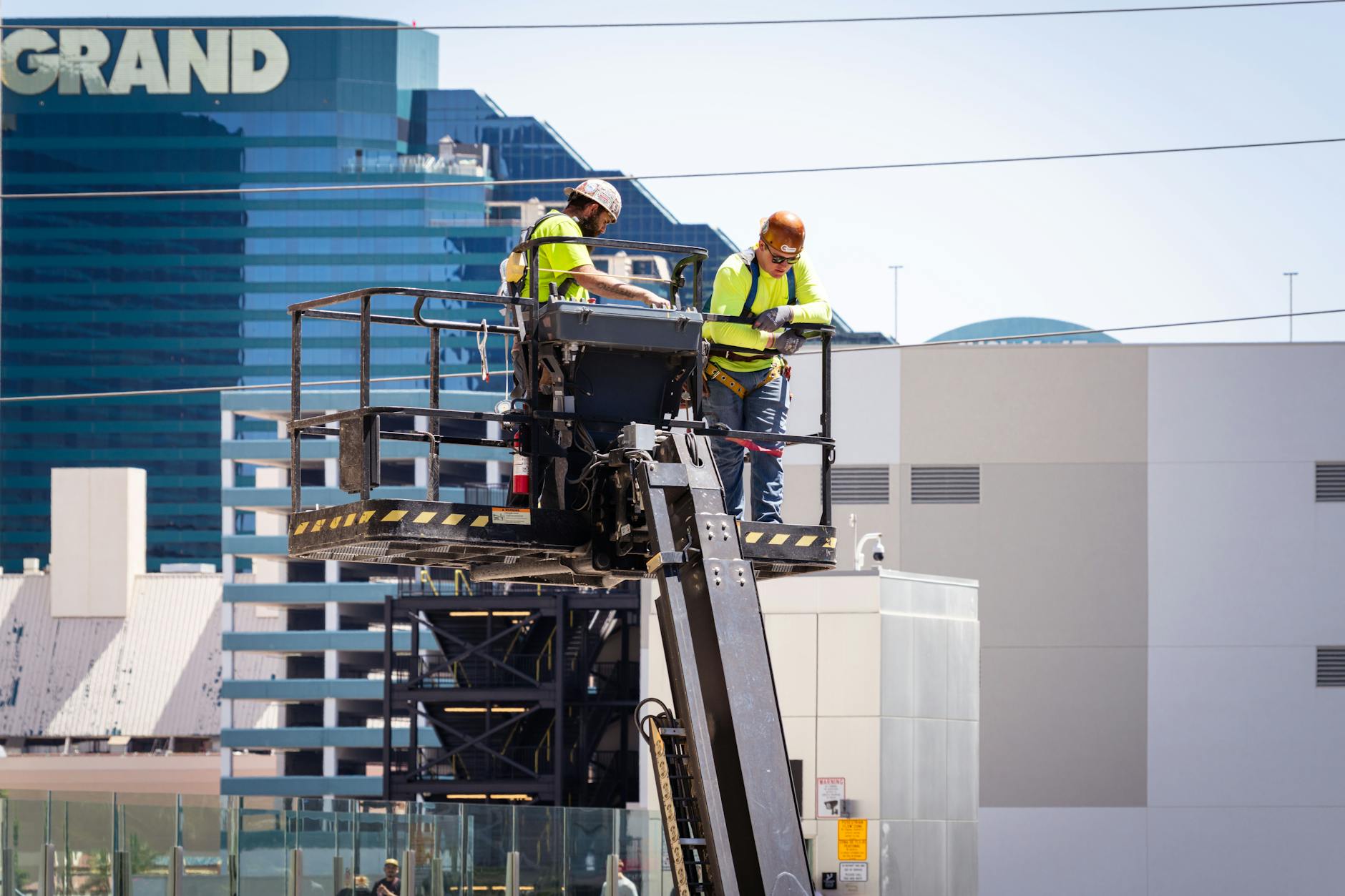 A close-up of high-quality concrete roofing tiles being carefully aligned and installed on a North Las Vegas home.