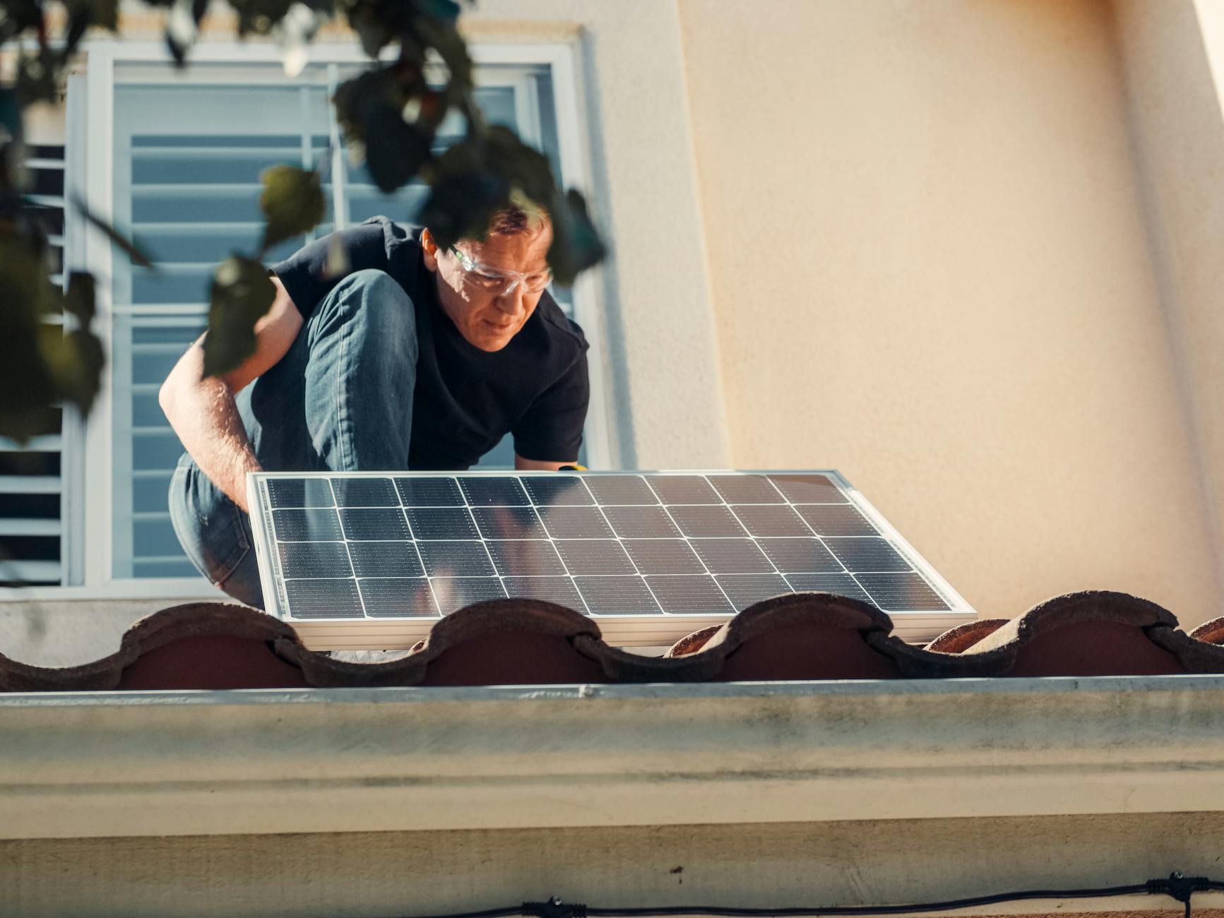 A close-up of high-quality concrete roofing tiles being neatly aligned and installed on a residential roof in Whitney.